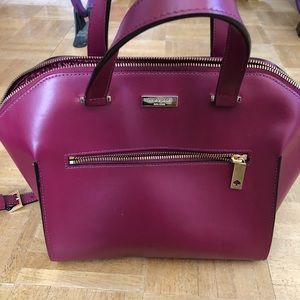 Shoulder and hand cranberry Kate Spade bag